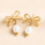 Stainless Steel Bow Pearl Drop Earrings In Gold, thumbnail 1 of 3