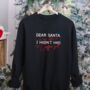Black Christmas Jumper With ‘Dear Santa, In My Defence I Hadn’t Had My Coffee Yet’ Slogan, thumbnail 1 of 7
