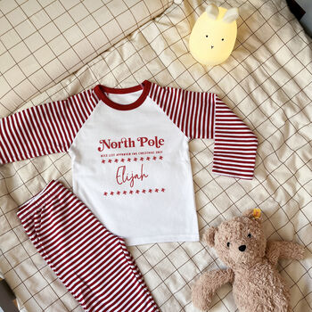 Personalised North Pole Christmas Rompersuit Or Pyjamas, 5 of 5