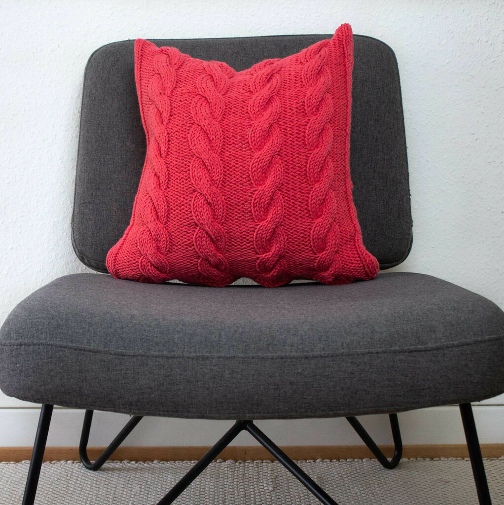 Hand Knit Chunky Cable Stitch Cushion In Salmon Pink, 1 of 5