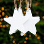 Set Of Four White Wooden Hanging Star Decorations, thumbnail 1 of 2