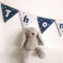 Dinosaur Bunting, Personalised Baby Name, White, Navy Blue, thumbnail 1 of 11