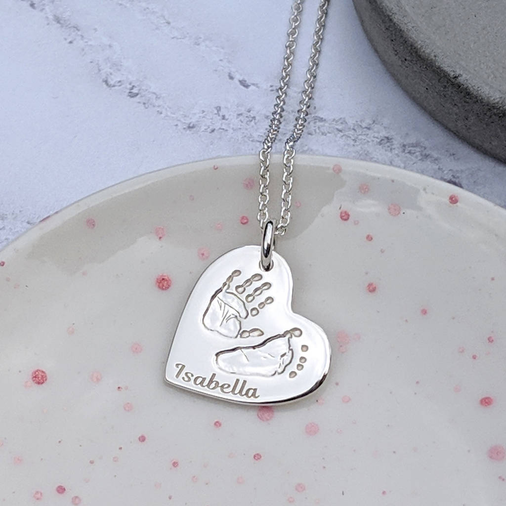 personalised silver hand print and footprint necklace by hold upon