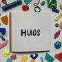 'Hugs' Upcycled Plastic Greetings Card, thumbnail 1 of 11