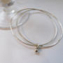 Delicate Double Silver Bangle With Silver Bead, thumbnail 1 of 4
