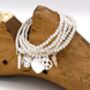 Betsy's Silver Charm Bracelet, thumbnail 1 of 11