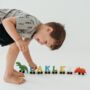 Personalised Brightly Coloured Dinosaur Wooden Train, thumbnail 1 of 2