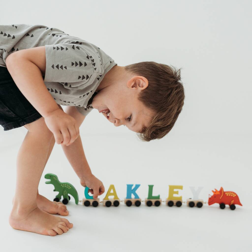 Personalised Brightly Coloured Dinosaur Wooden Train, 1 of 2