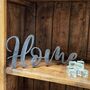 'Home' Metal Word Sign Wall Art Decoration, thumbnail 1 of 7