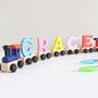 Personalised Coloured Wooden Name Train And Gift Bag, thumbnail 2 of 8