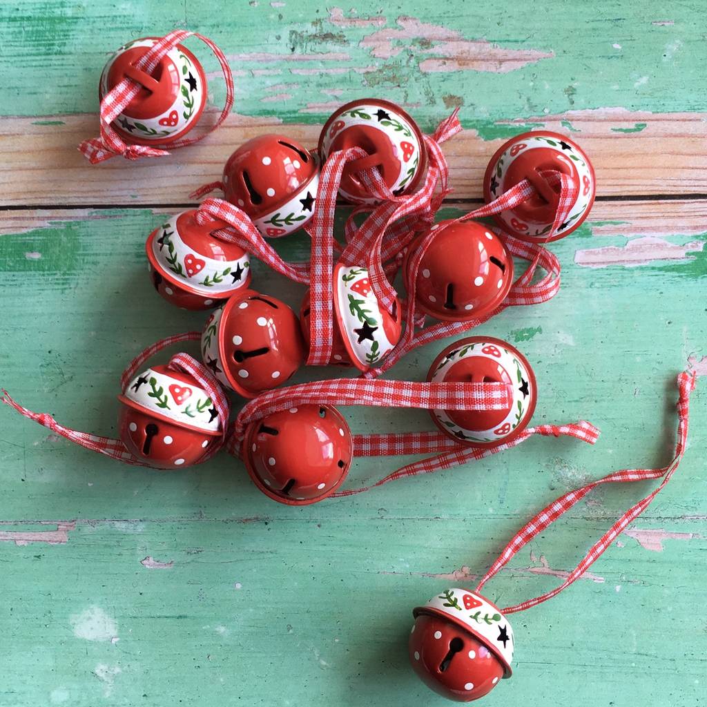 red and white christmas bells decorations by the christmas home