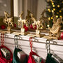 Santa's Sleigh Set Of Four Stocking Holders, thumbnail 1 of 6