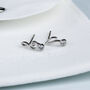 Sterling Silver Tiny Sparkly Music Note Stud Earrings, thumbnail 1 of 6