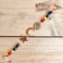 Recycled Brass Sun Moon And Star Chakra Hanging Bell, thumbnail 1 of 8