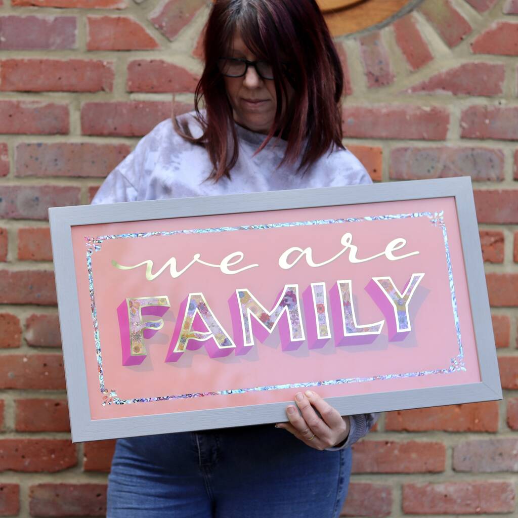 we-are-family-framed-handmade-gold-typographic-sign-by-colourful-kat