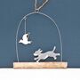 Dog Chasing Seagull Hanging Decoration, thumbnail 1 of 4