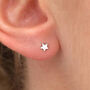 Tiny Sterling Silver Star Stud Earrings, thumbnail 1 of 2