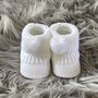 White Knitted Baby Booties With Pom Pom, thumbnail 1 of 9