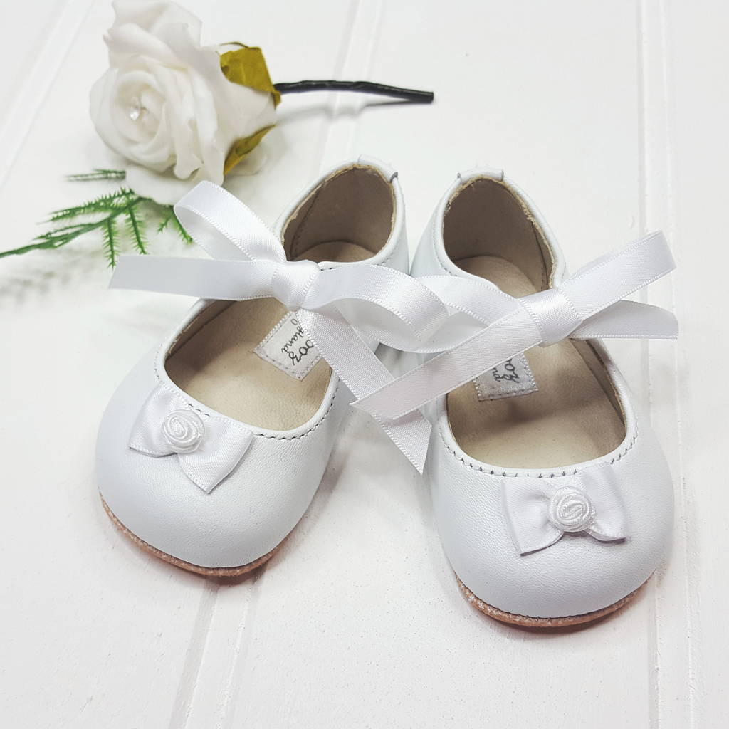 white pram shoes girl