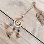 Handmade Fair Trade Brass Swirl Bell Wind Chime, thumbnail 3 of 6
