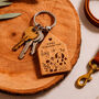 'Home Is Where The Dog Is' Dog House Shaped Keyring, thumbnail 1 of 3