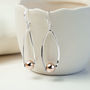 Sterling Silver Rose Gold Oval Ball Dangly Earrings, thumbnail 1 of 4