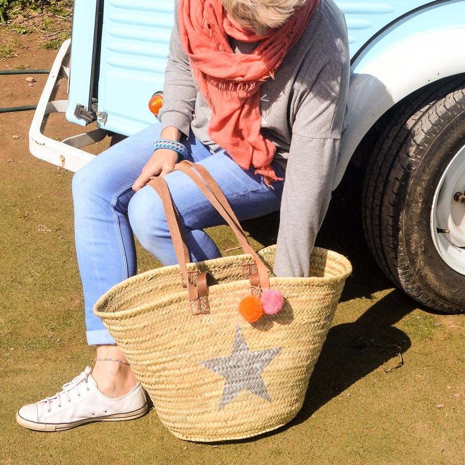 star straw basket with pom poms by roam devon
