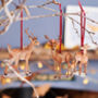 Family Of Deer Wooden Hanging Christmas Decorations, thumbnail 1 of 5