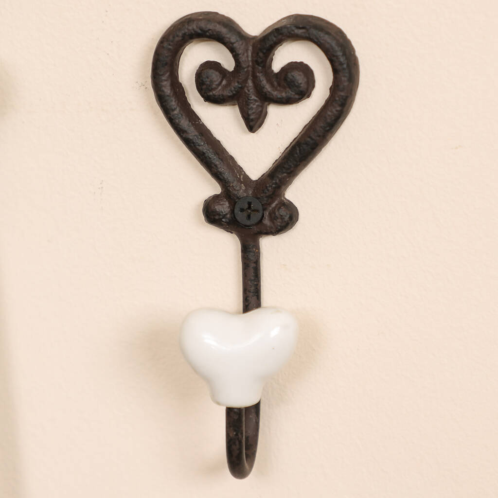 iron anniversary set of four love heart wall hooks by dibor