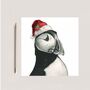 Vela The Puffin Festive Red Hat Christmas Card, thumbnail 2 of 5
