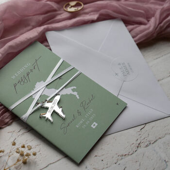 Sage Green Passport Invitation With Acrylic Plane Charms For Destination Wedding, 3 of 10