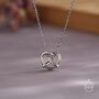 Sterling Silver Tiny Pretzel Heart Knot Pendant Necklace, thumbnail 1 of 11