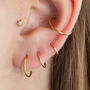 14 Carat Gold Tiny Star Labret Stud Earring, thumbnail 1 of 6