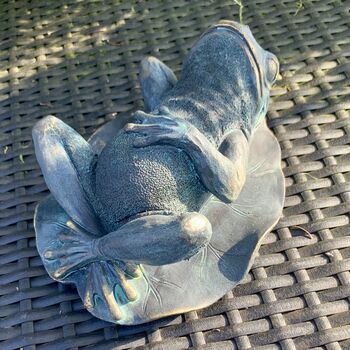 reclining frog statue