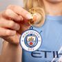 Manchester City Football Club Spinning Logo Backpack Hanger, thumbnail 1 of 5