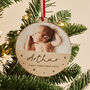 Personalised Baby's First Christmas Wooden Photo Bauble, thumbnail 1 of 3