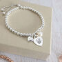 Sterling Silver Personalised Heart And Pearl Charm Bracelet With Prints, thumbnail 2 of 7