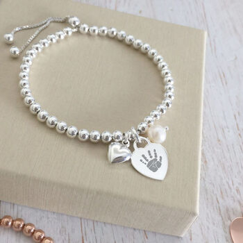 Sterling Silver Personalised Heart And Pearl Charm Bracelet With Prints, 2 of 7