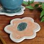 Handmade Flower Shaped Ceramic Coasters In Orange And Green, thumbnail 2 of 7