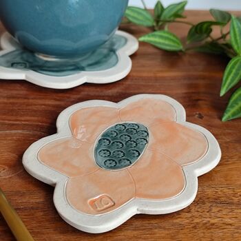 Handmade Flower Shaped Ceramic Coasters In Orange And Green, 2 of 7
