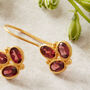 Garnet Triple Stone Gold Plated Silver Drop Earrings, thumbnail 3 of 12