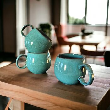 Set Of Four Reactive Glaze Sphere Mugs In Teal, 2 of 3
