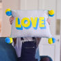 Embroidered 'Love' Pom Pom Cushion, thumbnail 1 of 2