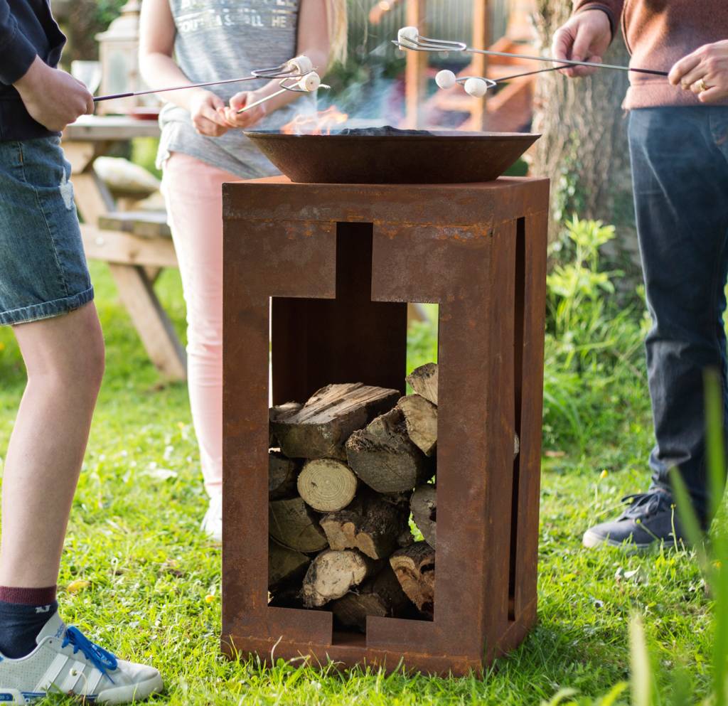 large tall firepit with wood store by garden leisure ...