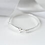 Silver Plated Cross Christening Bangle, thumbnail 1 of 2