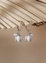 White Enamel Lily And Pearl Huggie Hoop Earrings, thumbnail 1 of 7