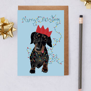 Slinky The Naught Christmas Sausage Dog Greeting Card, 2 of 3