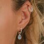 November Birthstone Blue Topaz Sterling Silver Huggie Hoop Earrings, thumbnail 1 of 12