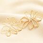 Oversized Hammered Flower Outline Stud Earrings In Gold, thumbnail 1 of 4