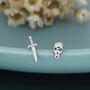Mismatched Tiny Sword And Skull Stud Earrings In Sterling Silver, thumbnail 1 of 10